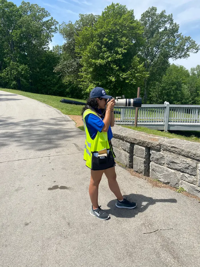 a woman with a large camera